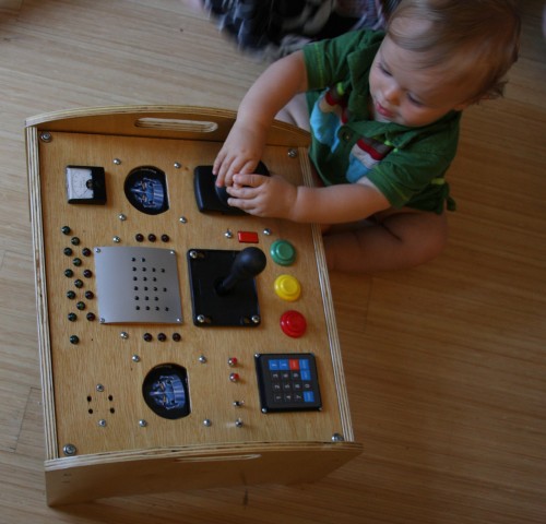 Harrison plays with his box